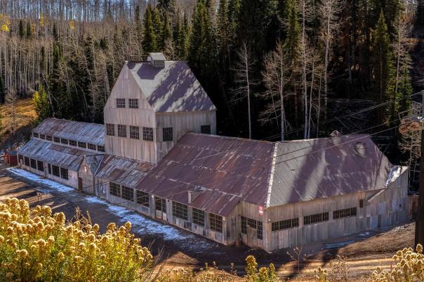 The Silver King Coalition Mine building with a dusting of snow during a sunny fall day in Park City, UT