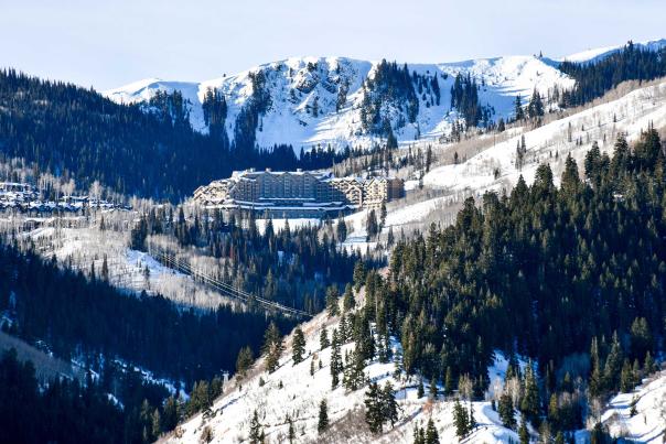 The luxury Montage Hotel at daytime surrounded by snow and forests at Deer Valley Resort in Park City, UT