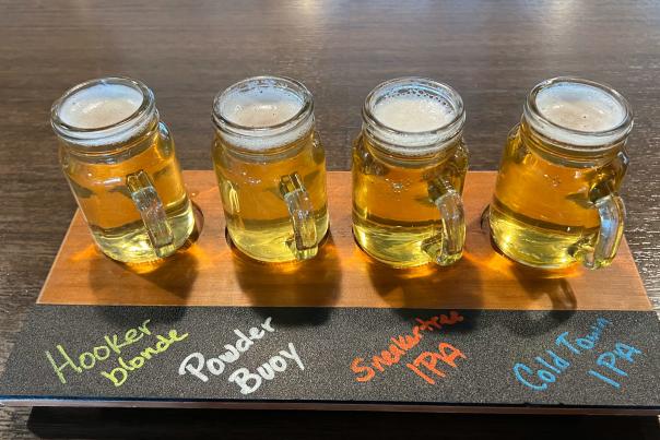 A flight of beers from Park City Brewing sits on a counter in Park City, UT