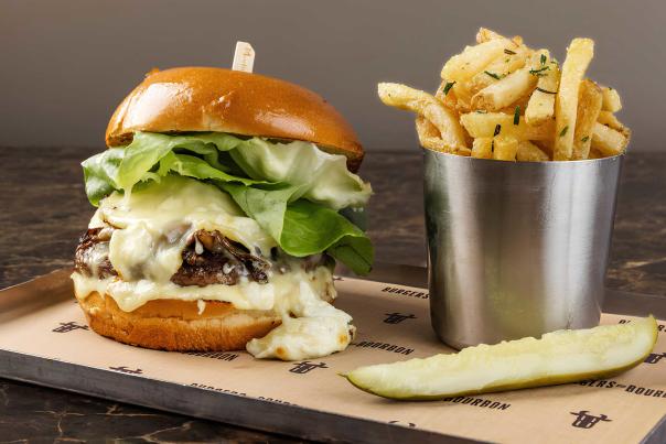 A cheese burger and fries on a metal platter at a restaurant in Park City, UT