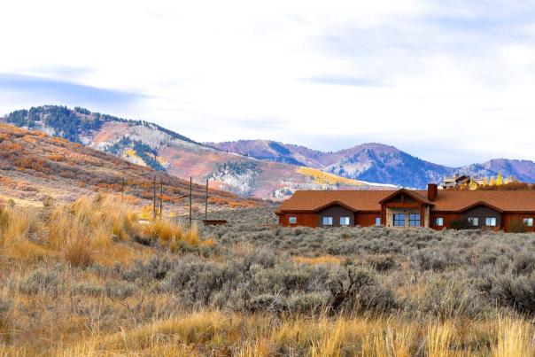 View of The Lodge at the National Ability Center in front of fall mountain in Park City, UT
