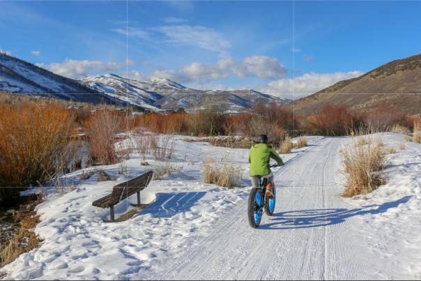 Person riding an Electric Fat Tire Bike on snow covered bike path