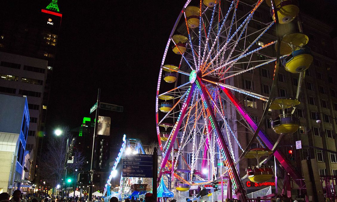 Fantastical Ferris wheel at First Night Raleigh; looking down a lively Fayetteville St.