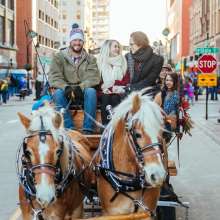 Enjoying a horse and wagon ride at Stroll on State
