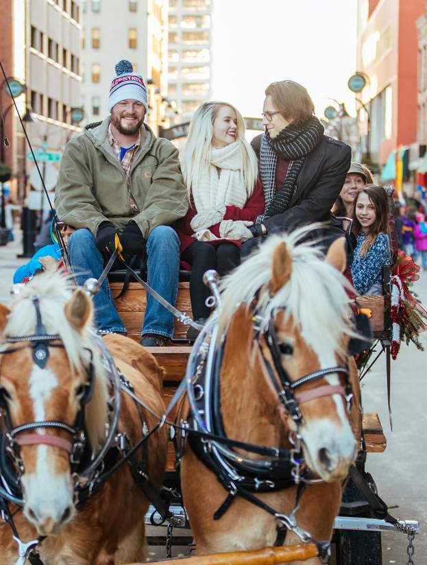 Enjoying a horse and wagon ride at Stroll on State
