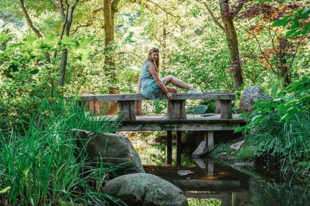 woman outside on bridge
