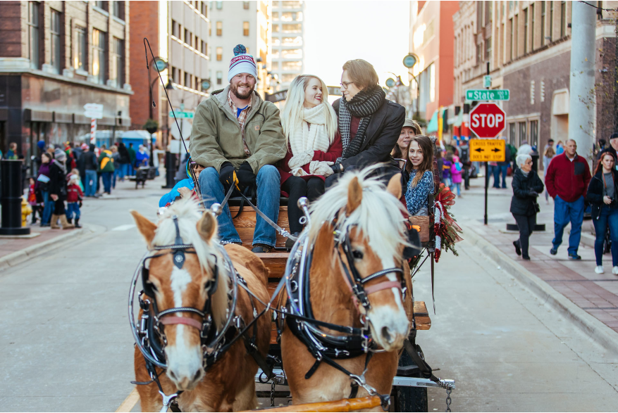Enjoying a horse and wagon ride at Stroll on State