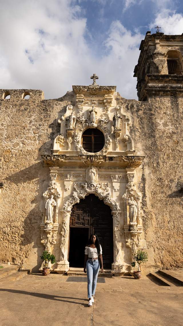 Woman walking away from Mission San Jose