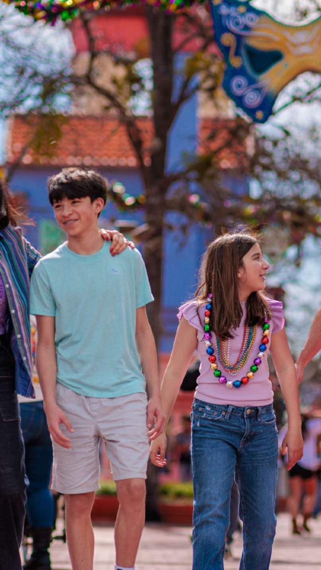 Family with teens at Six Flags Fiesta Texas.