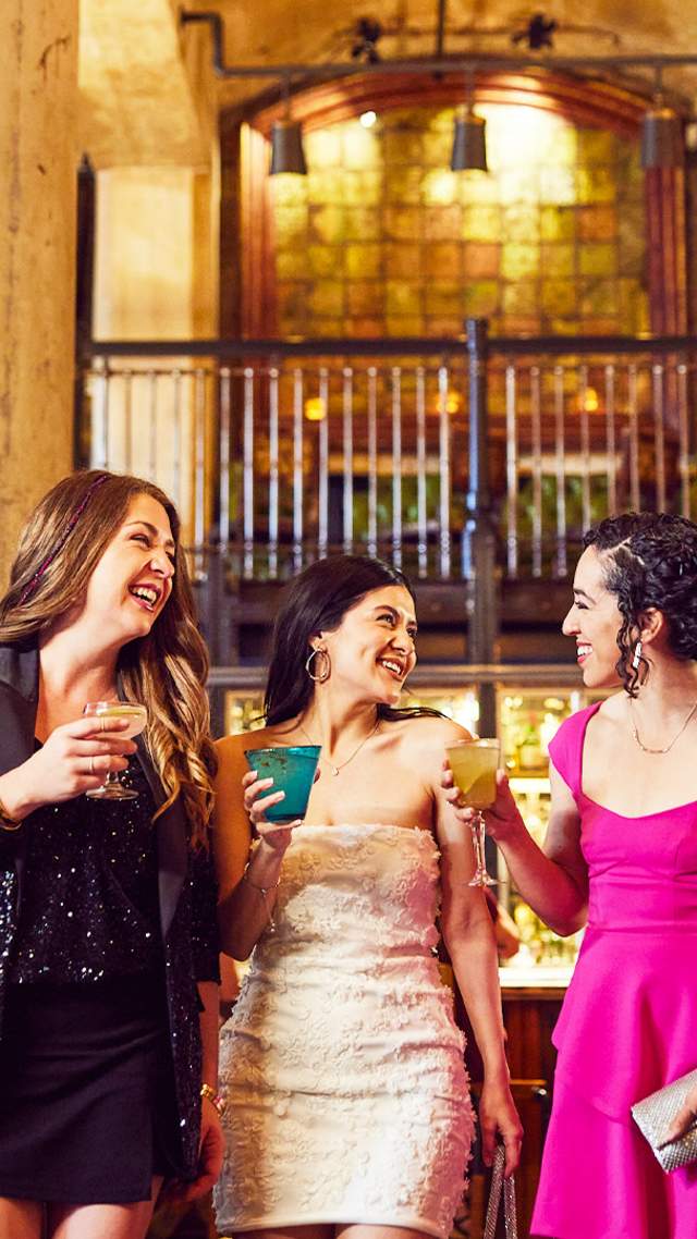 Three girls enjoying drinks in beautiful room with two large pillars at Sternewith.
