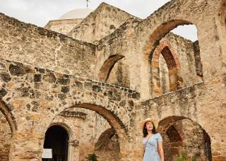 Woman walking through Mission San Jose in San Antonio Missions National Historical Park