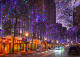 Houston Street in San Antonio adorned with holiday lights and wreaths.