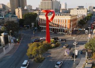 Overhead view of downtown San Antonio with Torch of Friendship sculpture.