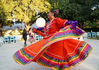 Woman dancing in red Folklorico dress