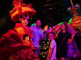 Family dressing with woman dressed in sugar skull attire