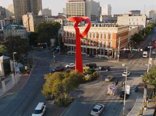 Overhead view of downtown San Antonio with Torch of Friendship sculpture.