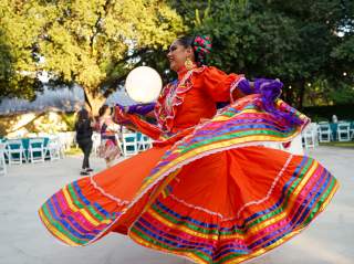 Woman dancing in red Folklorico dress