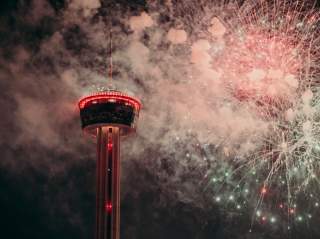 Fireworks in front of the Tower of the Americas at New Year's Eve party in San Antonio.