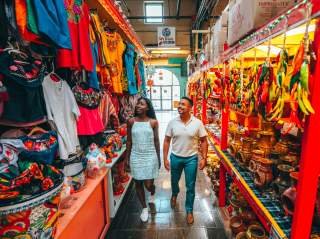 Man and woman walking through aisle at Historic Market Square