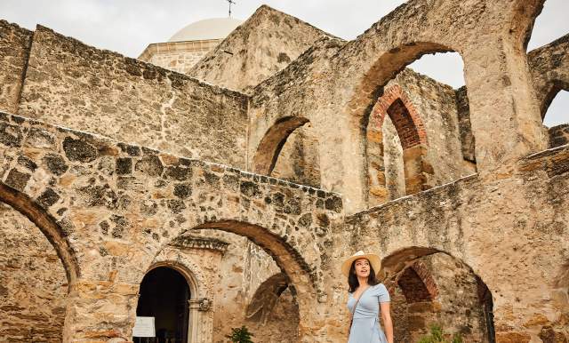 Woman walking through Mission San Jose in San Antonio Missions National Historical Park