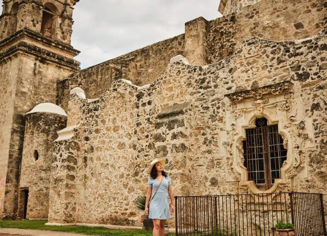 Woman walking through Mission San Jose in San Antonio Missions National Historical Park