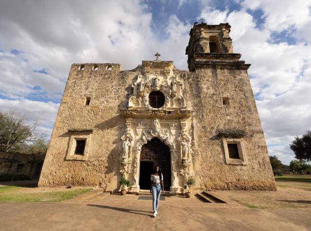 Woman walking away from Mission San Jose