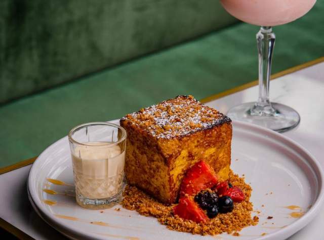 Pastry next to glass of sweet drink