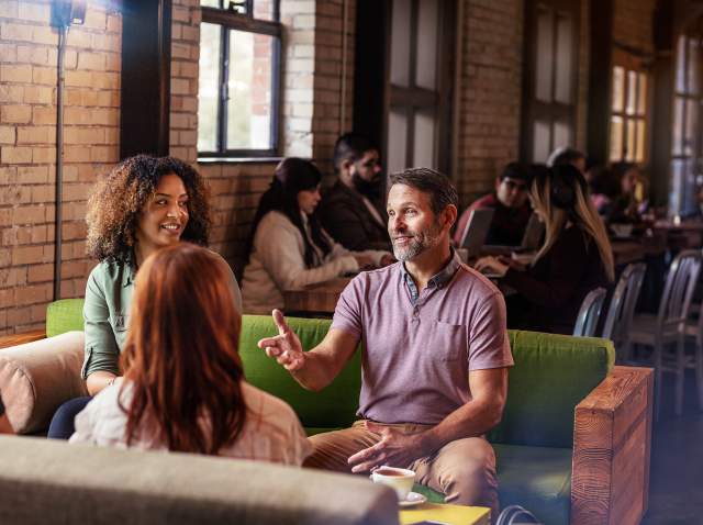 Meeting professionals meet over coffee