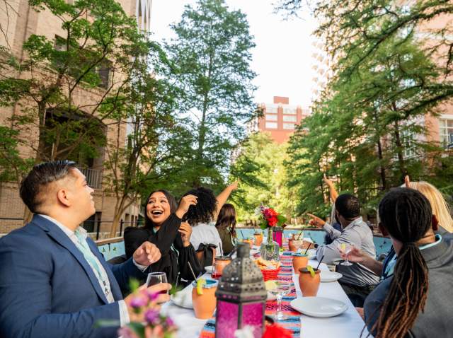 Group enjoying dinner on a river barge on the River Walk.