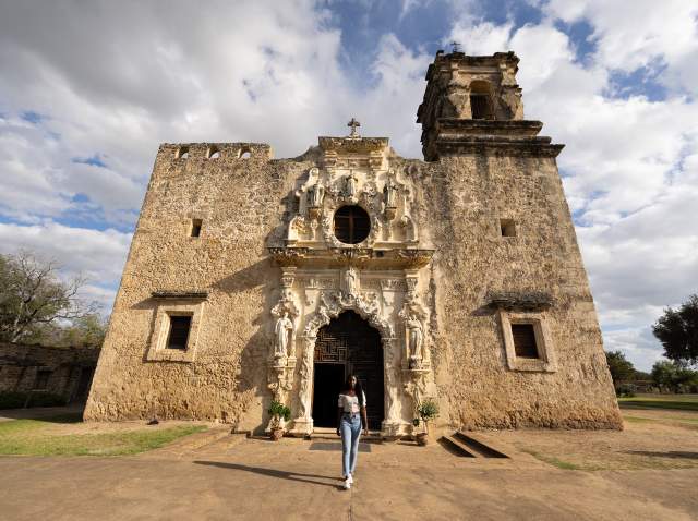 Woman walking away from Mission San Jose