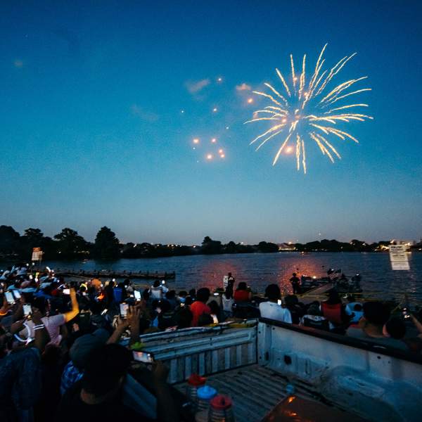 People watching fireworks at Woodlawn Lake Park in San Antonio.