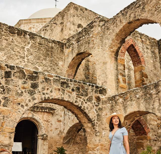 Woman walking through Mission San Jose in San Antonio Missions National Historical Park