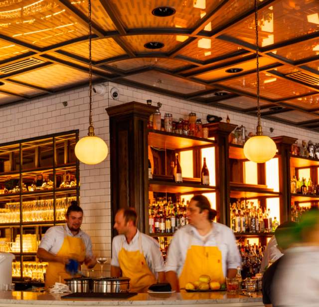 Bartenders behind bar