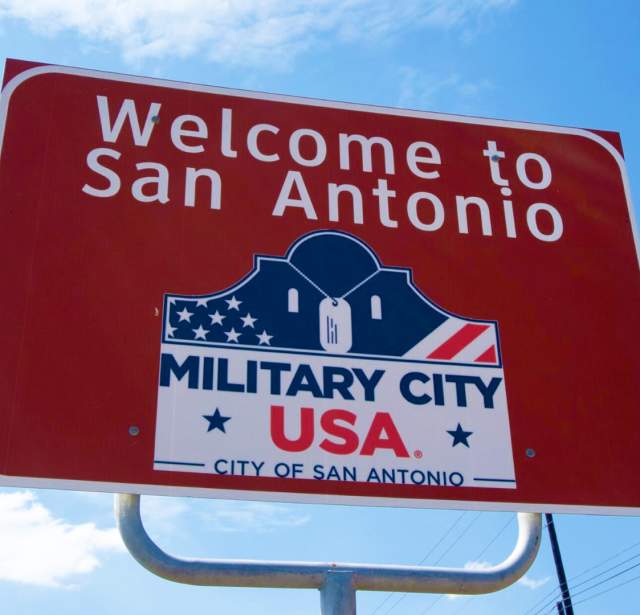 Road sign saying "Welcome to San Antonio. Military City, USA"