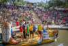 River barge with cowboy boots floating through River Walk