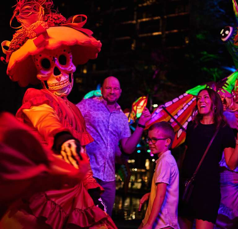 Family dressing with woman dressed in sugar skull attire