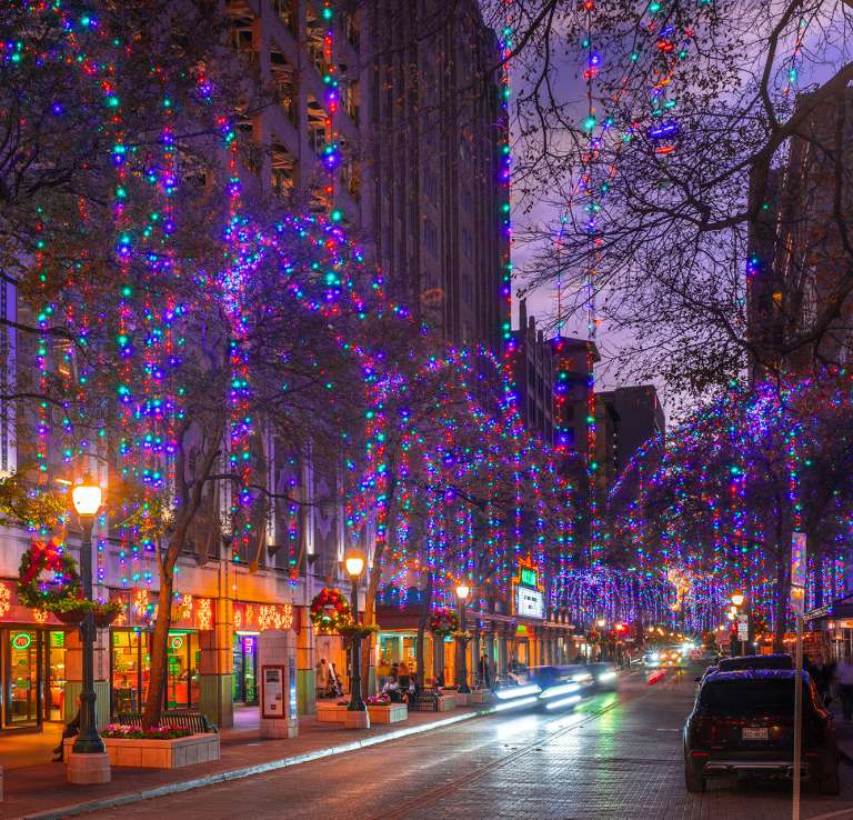 Houston Street in San Antonio adorned with holiday lights and wreaths.