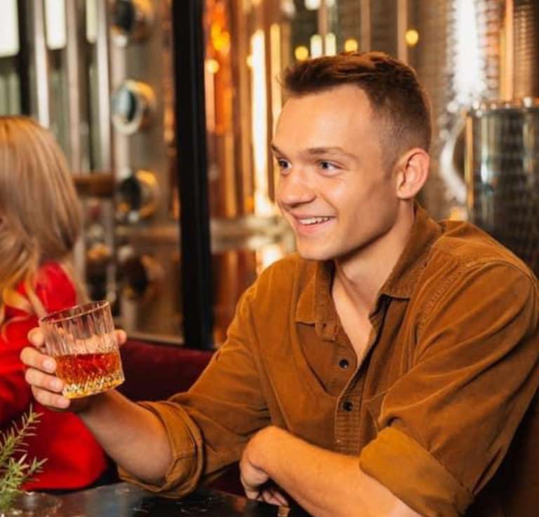 Man and woman drinking drinks at Devils River Whiskey