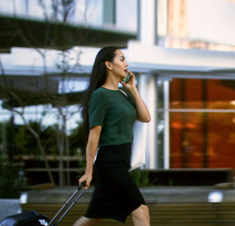 Woman walking and talking on phone
