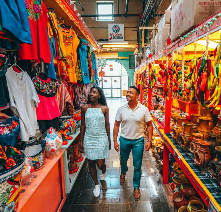 Man and woman walking through aisle at Historic Market Square