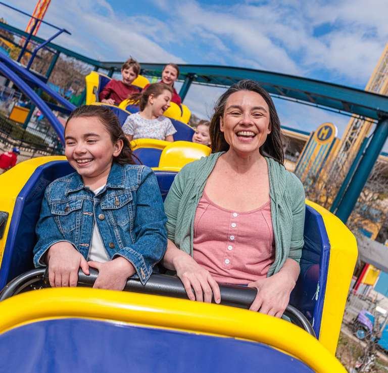 Mom and Daughter ridding a rollercoaster