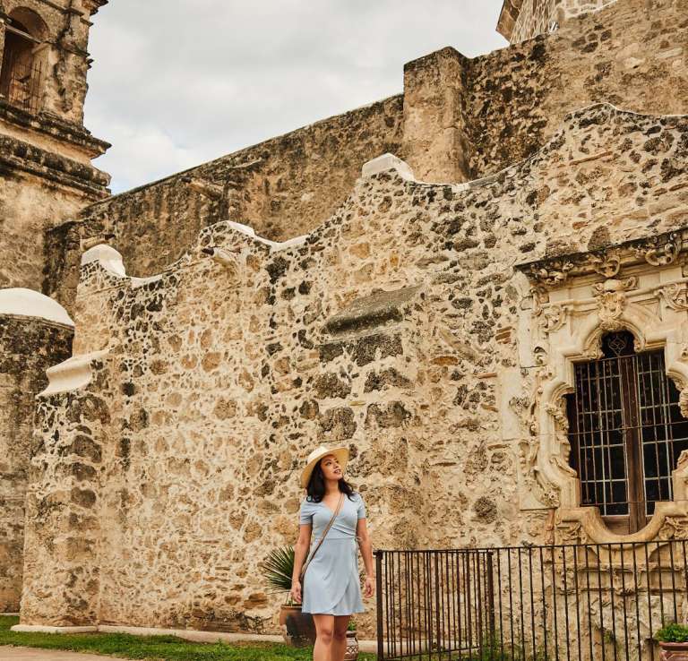 Woman walking through Mission San Jose in San Antonio Missions National Historical Park