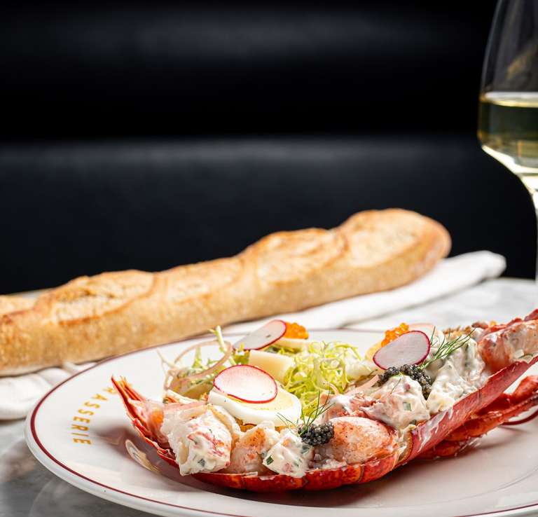 lobster salad with a glass of wine and baguette