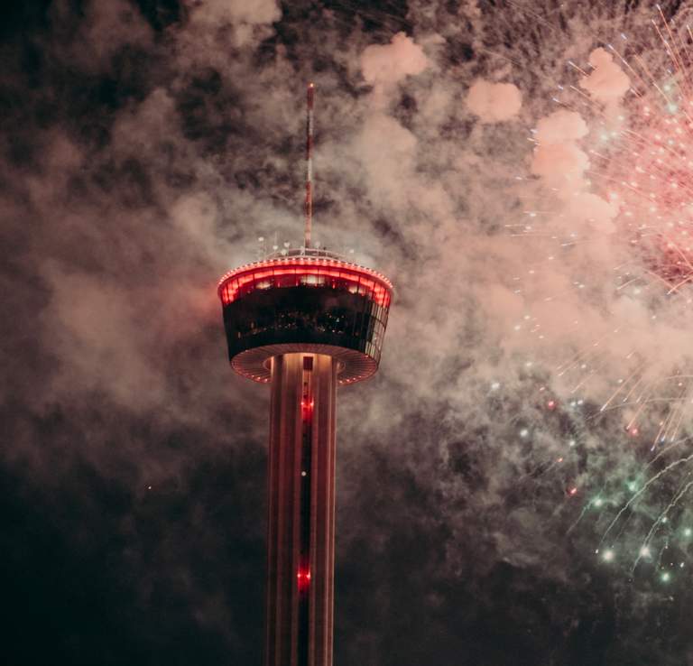 Fireworks in front of the Tower of the Americas at New Year's Eve party in San Antonio.
