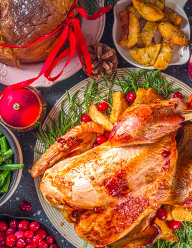 Holiday turkey dinner surrounded by sides