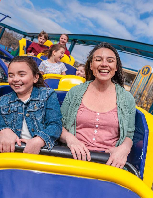 Mom and Daughter ridding a rollercoaster