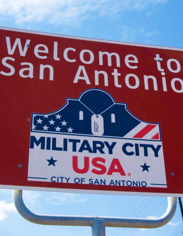 Road sign saying "Welcome to San Antonio. Military City, USA"