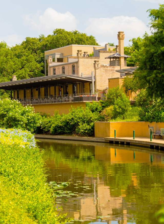 Clear day on Mueseum Reach of River Walk with Tre Trattoria in background.