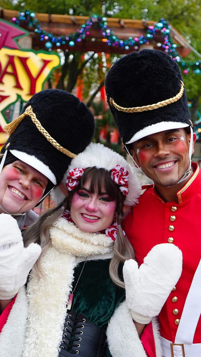 Costumed characters dressed as nutcrackers and Christmas elves at Holiday in the Park at Six Flags Fiesta texas.