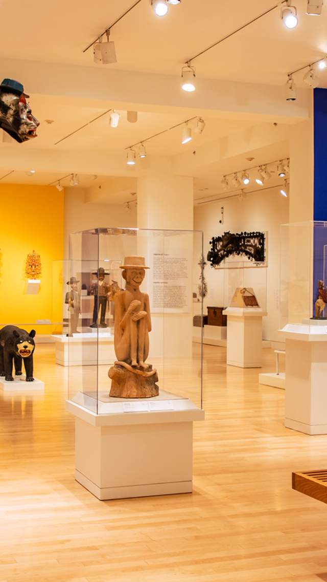 Art gallery room with displays under protective glass